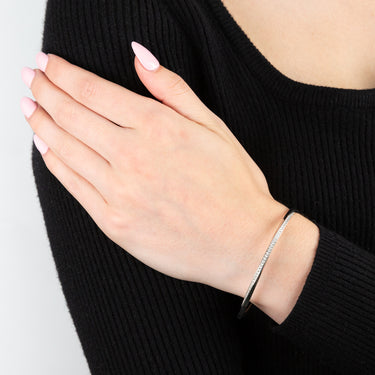 Sterling Silver Rhodium Plated Cubic Zirconia Twisted Hinged Bangle