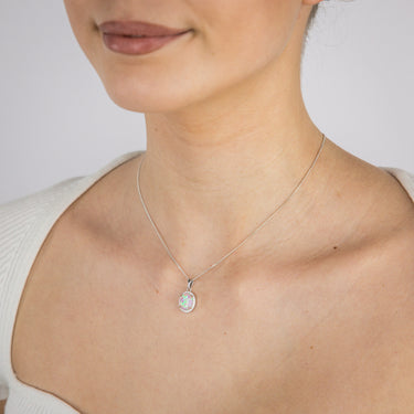 Sterling Silver Rhodium Plated Cubic Zirconia Created Pink Opal Oval Pendant